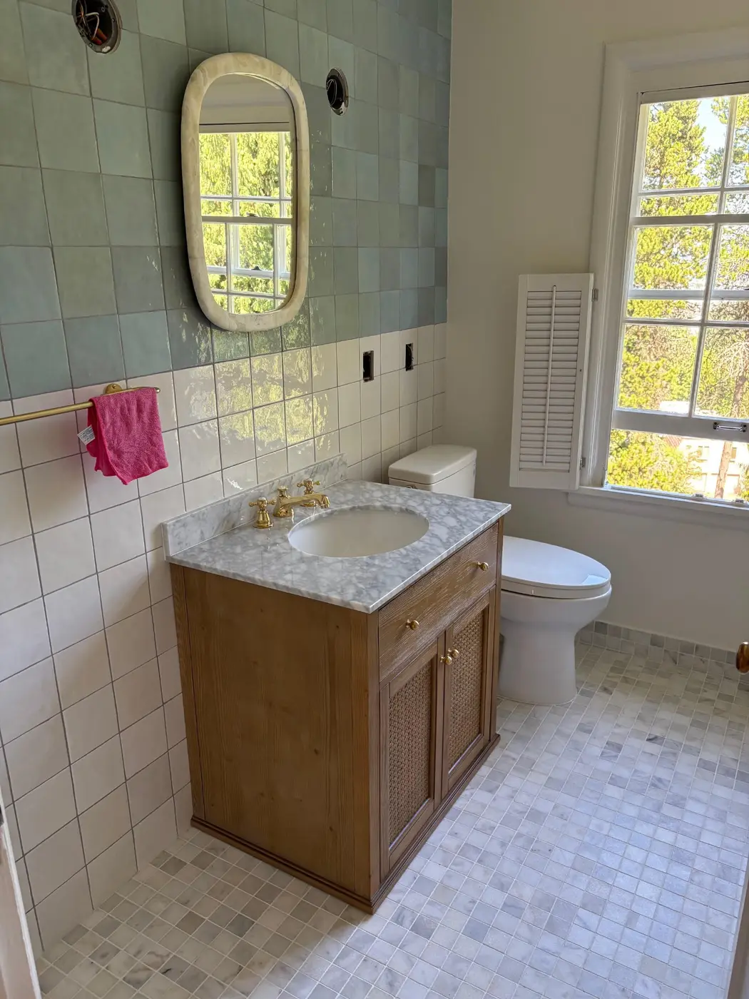 Vintage bathroom remodel with sage zellige tile, marble vanity, and brushed gold cross-handle faucet by Wild Pine Plumbing in Portland, OR