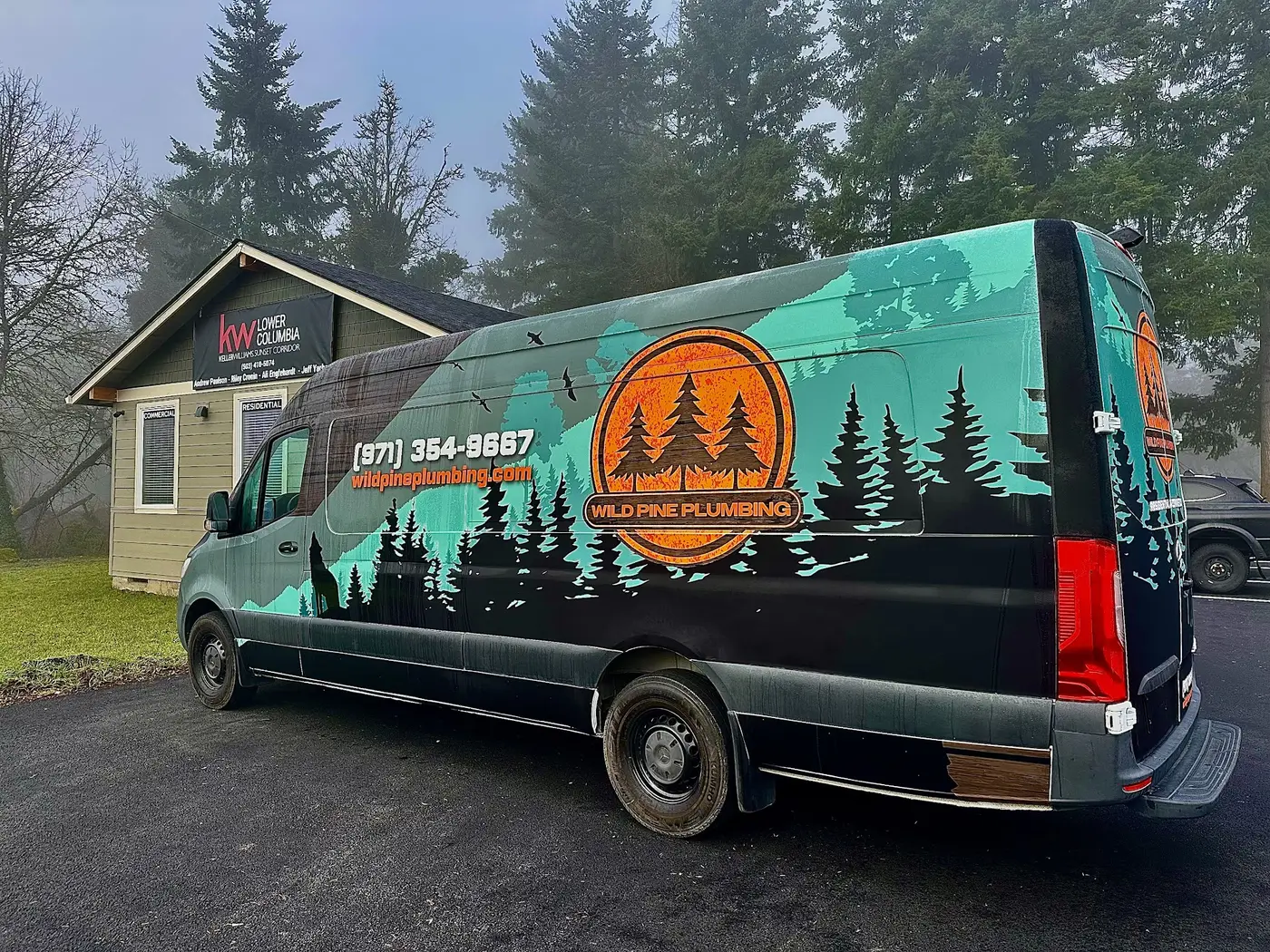 Wild Pine Plumbing wrapped Mercedes Sprinter van parked at the office on a foggy Columbia County, Oregon morning